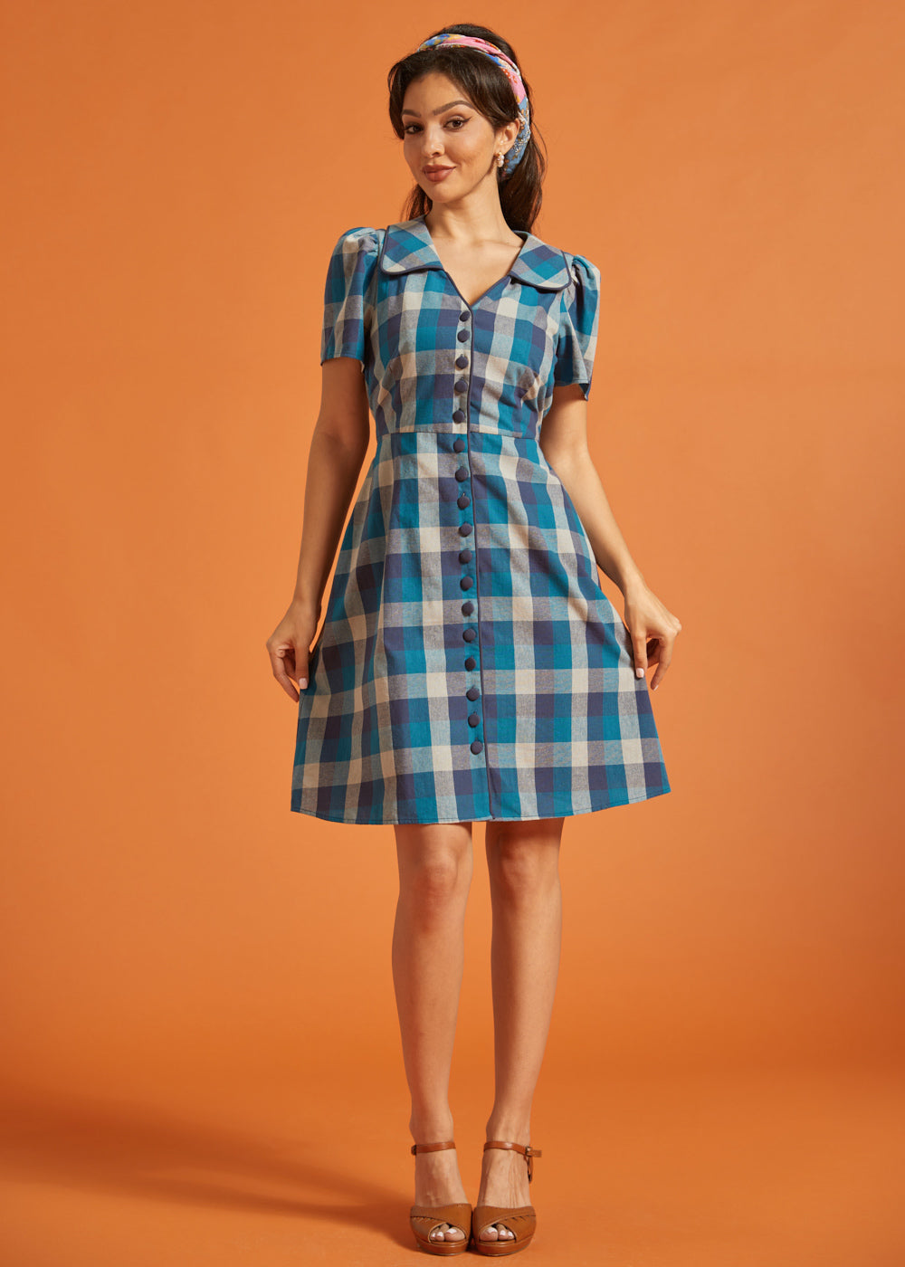 Full-length view of blue plaid A-line shirt dress with pockets and oversized collar