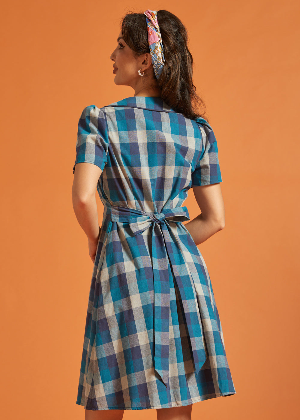 Back view of blue plaid cotton shirt dress with self-tie waist sash
