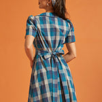 Back view of blue plaid cotton shirt dress with self-tie waist sash