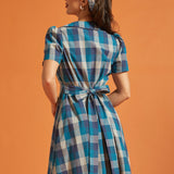 Back view of blue plaid cotton shirt dress with self-tie waist sash