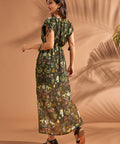 Back view of tropical maxi dress with tassel sleeve ties and flowing silhouette.