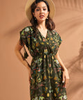 Close-up of faux wrap neckline and whimsical underwater print on green maxi dress.