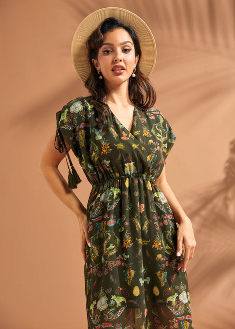 Close-up of faux wrap neckline and whimsical underwater print on green maxi dress.