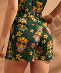 Back view of tropical tiki print shorts with relaxed fit and elastic waistband.