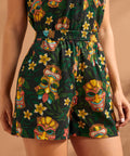 Front view of black tropical novelty print shorts with comfortable elastic waist.