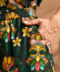 Close-up of side pocket on tropical tiki print linen blend shorts.