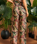 Back view of wide-leg novelty print pants paired with matching top.
