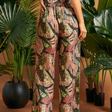 Back view of wide-leg novelty print pants paired with matching top.