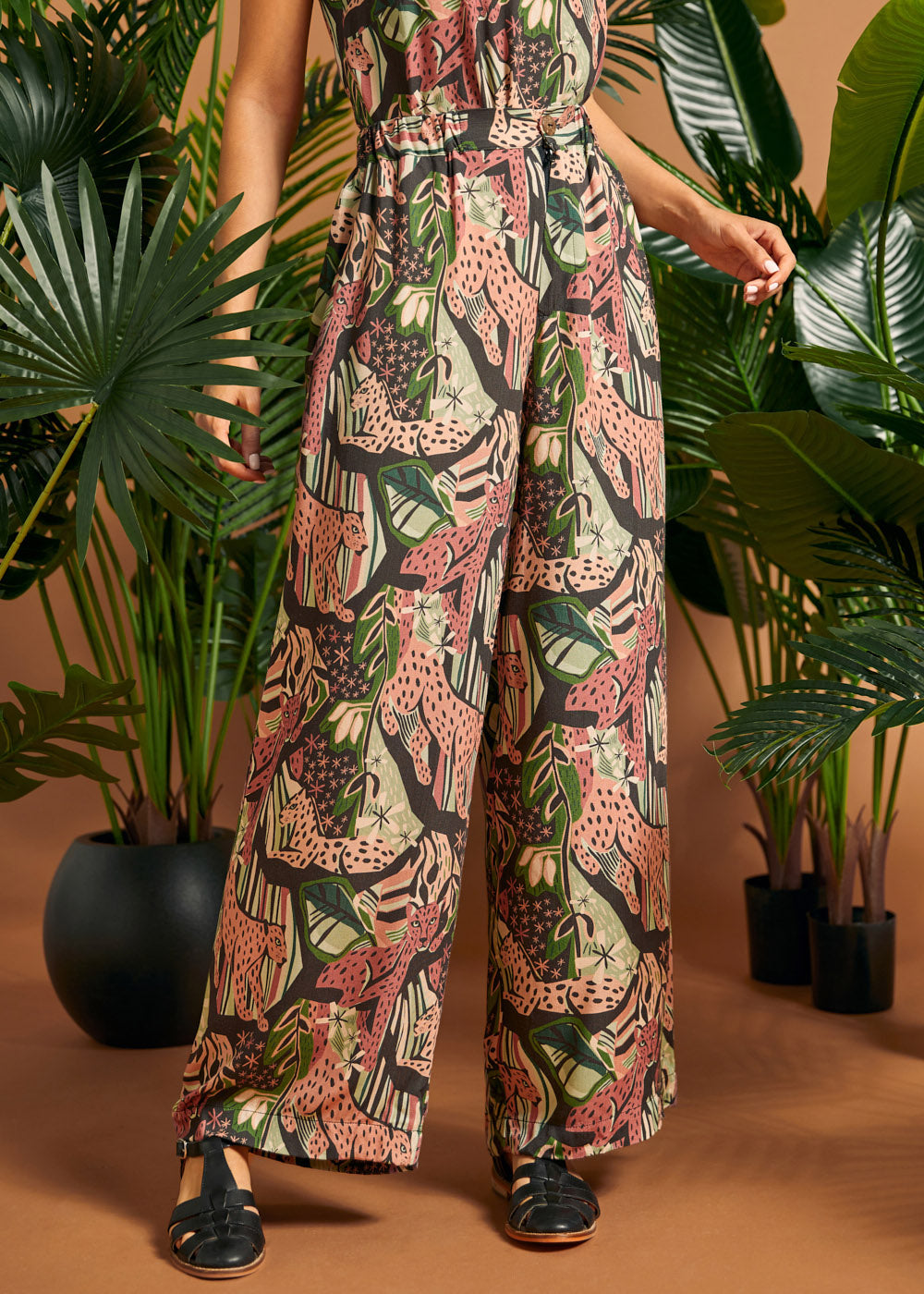 Front detail of wide-leg pants featuring side pockets and elasticized back waist.