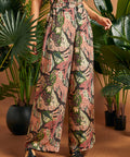 Front detail of wide-leg pants featuring side pockets and elasticized back waist.