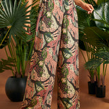 Front detail of wide-leg pants featuring side pockets and elasticized back waist.