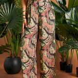 Side view of lightweight jungle print palazzo pants with flowing legs.