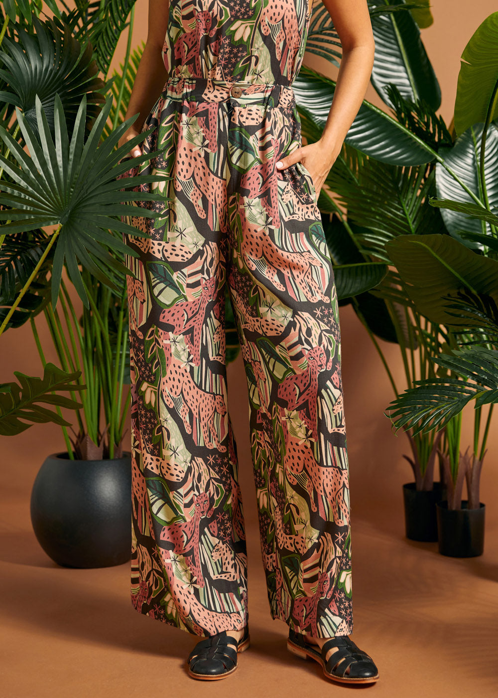 Close-up of the tropical novelty print and relaxed wide-leg silhouette.