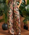 Close-up of the tropical novelty print and relaxed wide-leg silhouette.