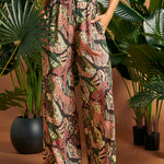 Close-up of the tropical novelty print and relaxed wide-leg silhouette.