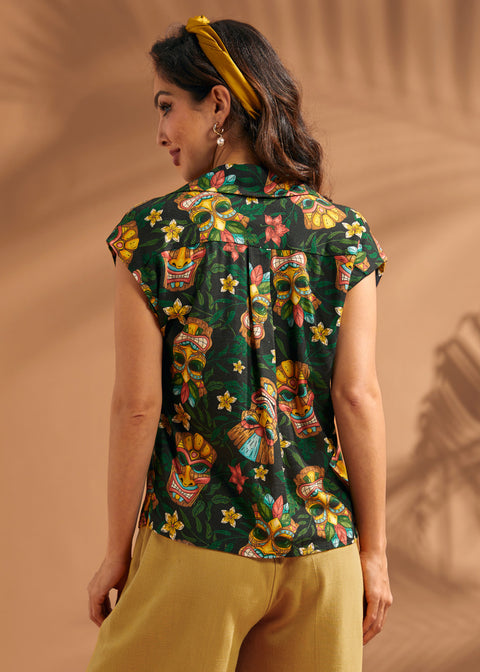 Back view of tropical novelty print blouse with back yoke and center pleat.