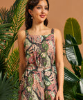Woman wearing a cropped jungle cat print tank top with matching pants.