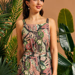 Woman wearing a cropped jungle cat print tank top with matching pants.