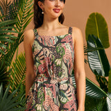 Woman wearing a cropped jungle cat print tank top with matching pants.