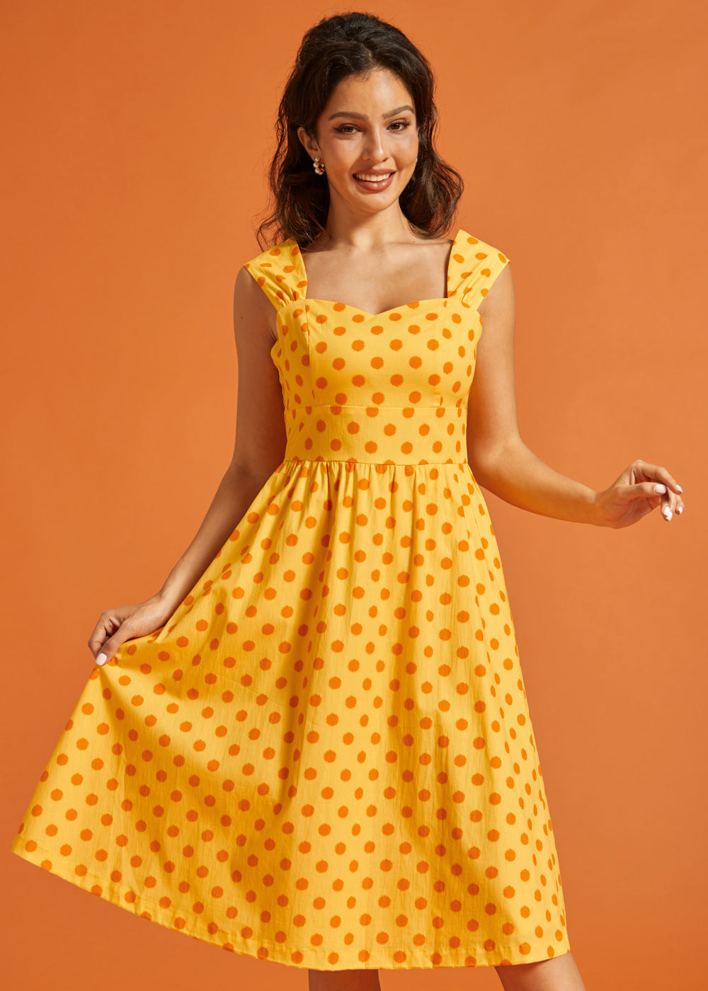 Front view of yellow cotton dress featuring a vintage-inspired silhouette and side pockets.