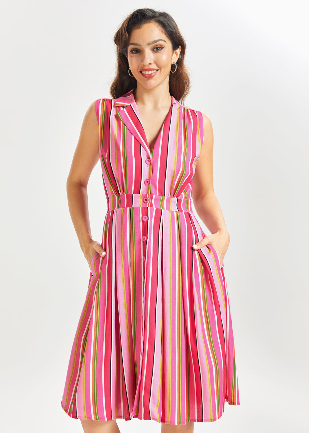 Woman wearing a pink striped summer dress on a white background