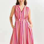 Woman wearing a pink striped summer dress on a white background