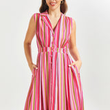 Woman wearing a pink striped summer dress on a white background