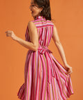 Back view of striped midi dress with attached self-tie and elastic back waist.