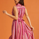 Back view of striped midi dress with attached self-tie and elastic back waist.