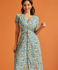 Front view of vintage-inspired checkerboard novelty print dress with puff sleeves.