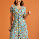 Front view of vintage-inspired checkerboard novelty print dress with puff sleeves.