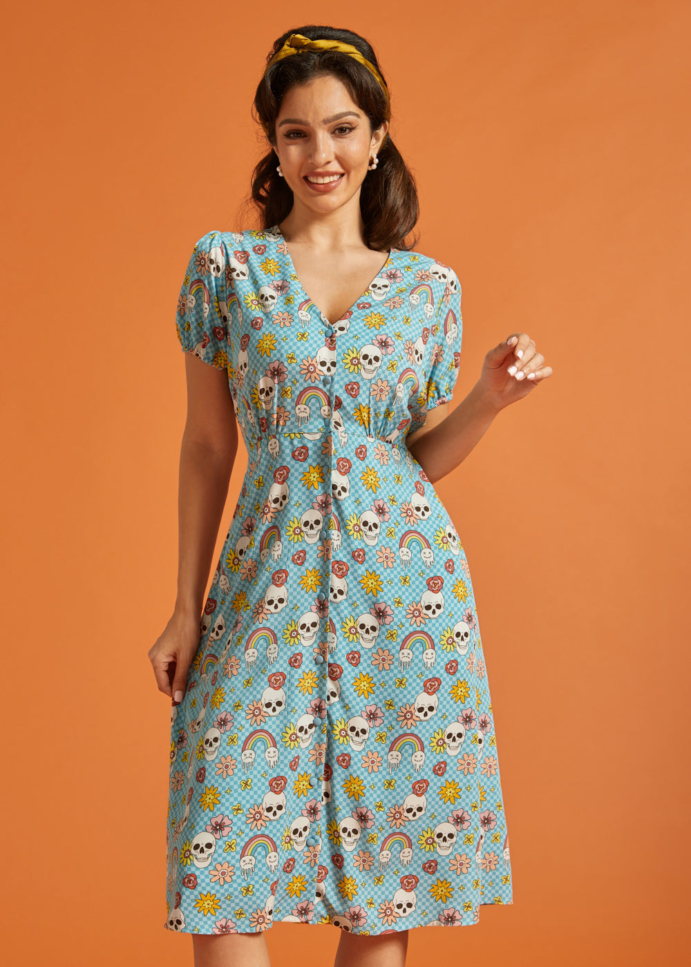 Front view of vintage-inspired checkerboard novelty print dress with puff sleeves.