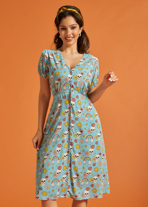 Front view of vintage-inspired checkerboard novelty print dress with puff sleeves.