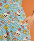 Detail of side pocket on vintage-inspired novelty skull print dress.
