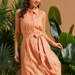 Front view of a sleeveless linen blend button-front dress with vertical stripes.