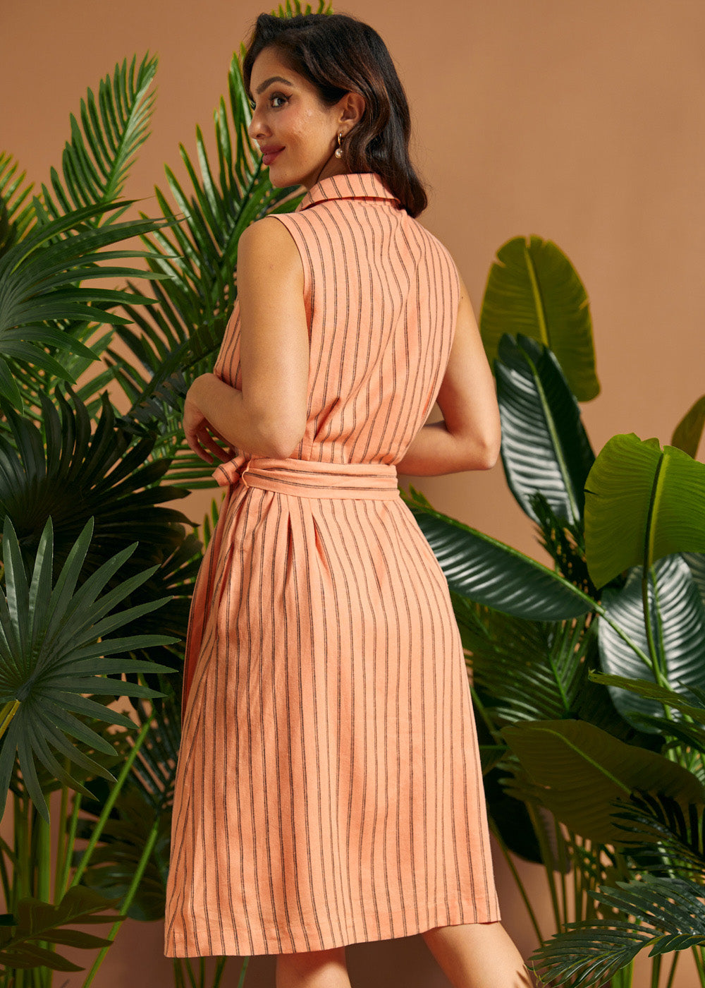 Back view of a sleeveless striped linen blend shirt dress.