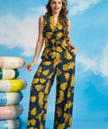 Woman wearing tropical leaf print tie-front shirt with matching wide-leg pants