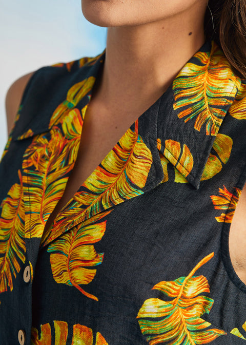 Close-up of convertible collar and tropical leaf print on sleeveless retro shirt