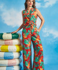Woman wearing tropical print sleeveless shirt with matching wide-leg pants