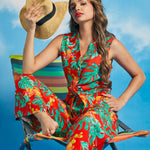 Woman wearing tropical print sleeveless tie-front shirt in Tropical Punch