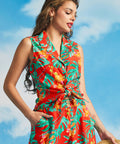 Woman wearing vibrant tropical print sleeveless top with high-waisted matching pants