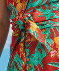 Close-up of tropical floral print and tie-front detail on retro sleeveless shirt