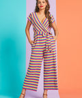 Model posing in rainbow stripe cropped wide-leg jumpsuit with pockets and adjustable waist tie