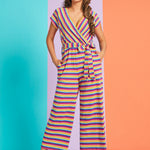 Model posing in rainbow stripe cropped wide-leg jumpsuit with pockets and adjustable waist tie