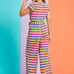 Back view of rainbow stripe wide-leg jumpsuit with short sleeves and elastic waist