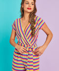 Front view of rainbow stripe wide-leg jumpsuit with short sleeves and pockets