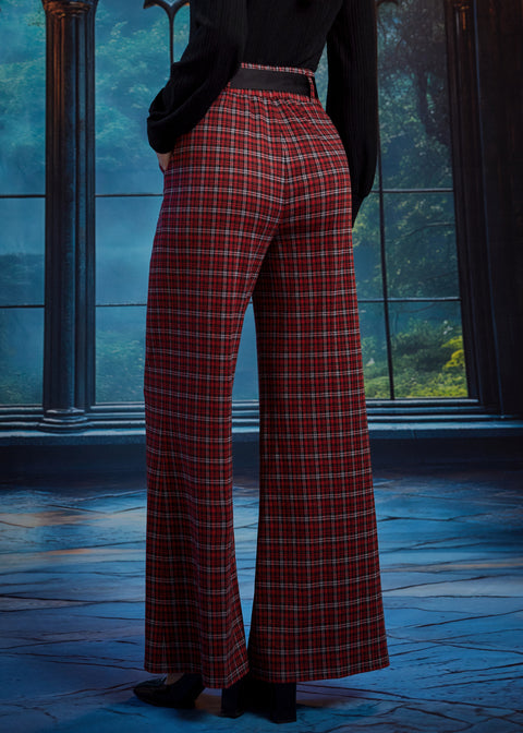 Back view of woman wearing red tartan plaid wide leg pants showing the elasticized back waist and full-length wide-leg silhouette