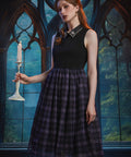 Woman styling the Evening Enchantment Fit & Flare Dress in Spellbound Plaid with an embellished collar and elegant fit-and-flare silhouette.