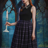 Woman styling the Evening Enchantment Fit & Flare Dress in Spellbound Plaid with an embellished collar and elegant fit-and-flare silhouette.