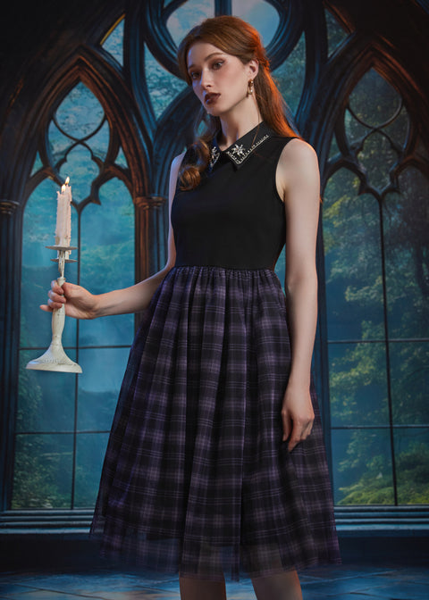 Woman styling the Evening Enchantment Fit & Flare Dress in Spellbound Plaid with an embellished collar and elegant fit-and-flare silhouette.